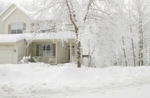 snow-covered-house-with-ice-in-trees